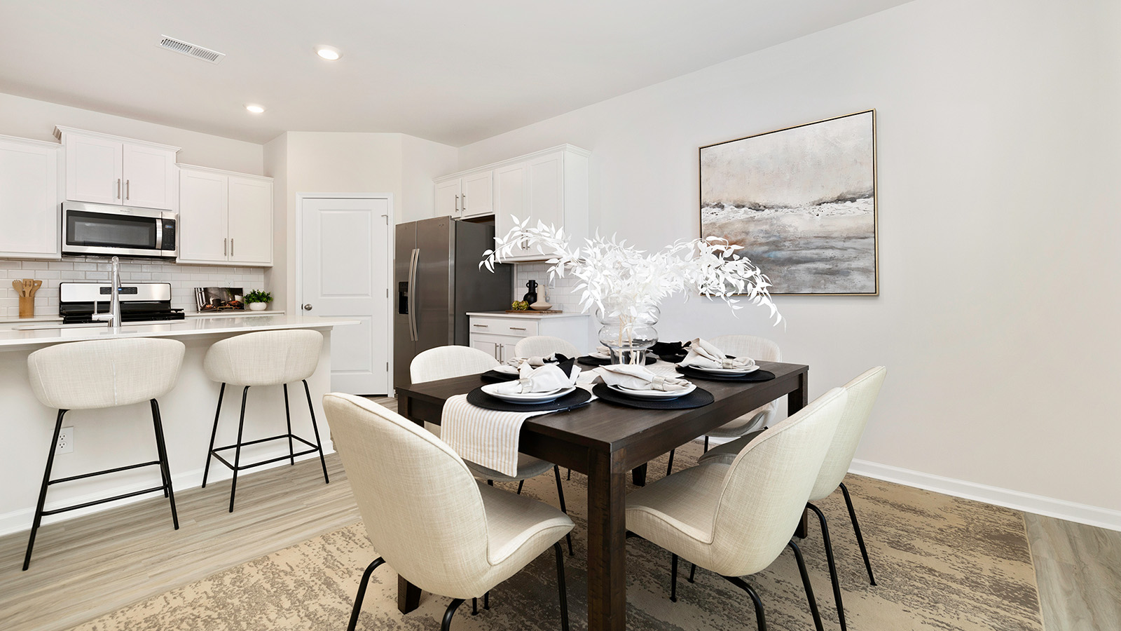 Dining area with wood floors and sliding glass back door