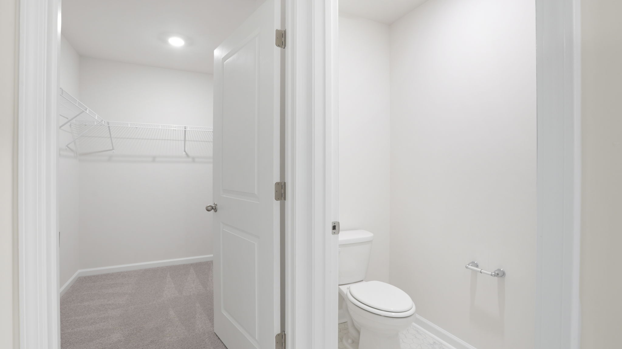 Primary bathroom with walk in closet