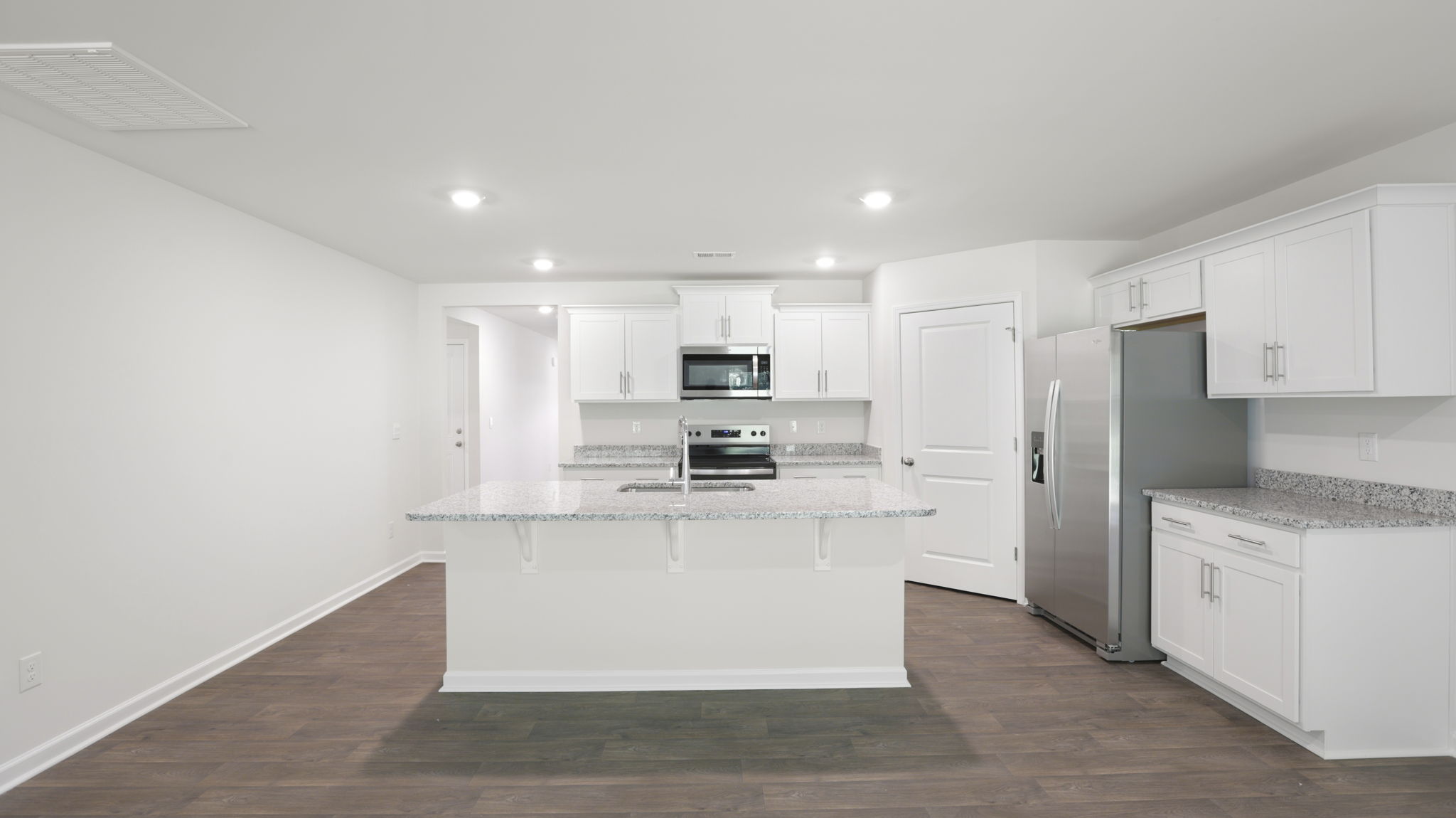 Open kitchen with stainless steel appliances