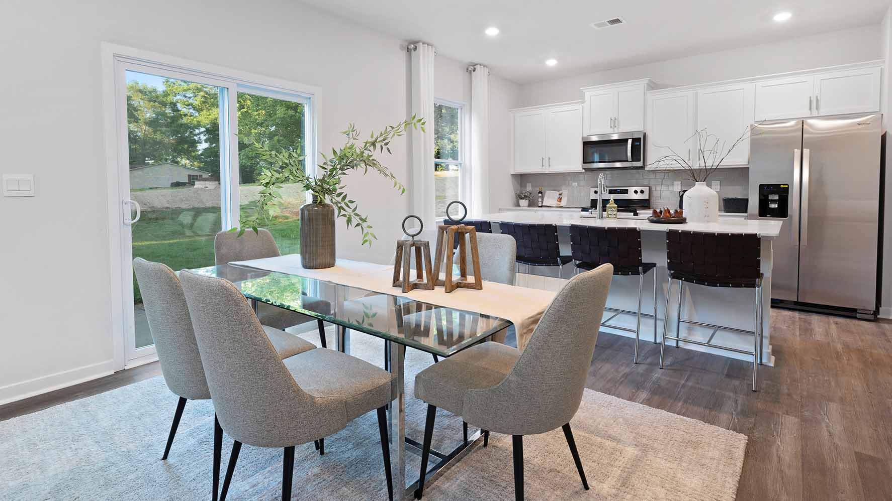 Dining room beside kitchen with sliding glass back door
