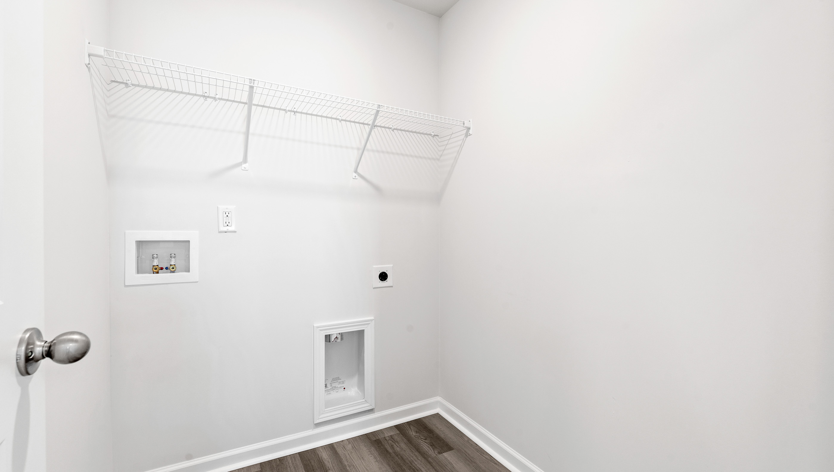 Laundry room with shelving