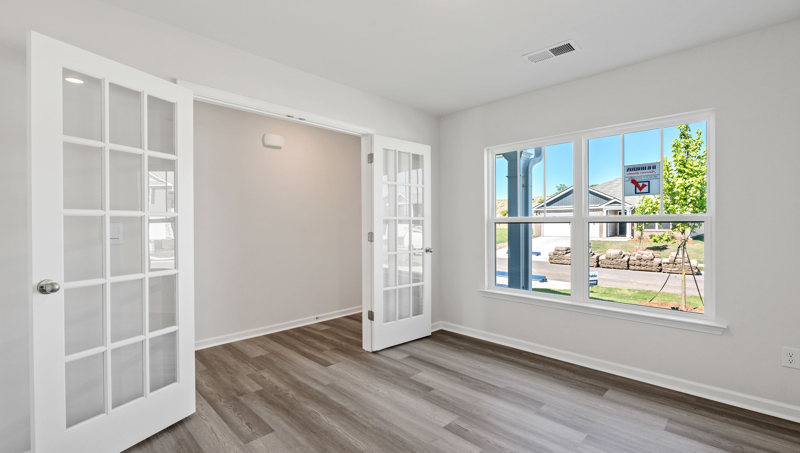 Office with large window and glass double doors