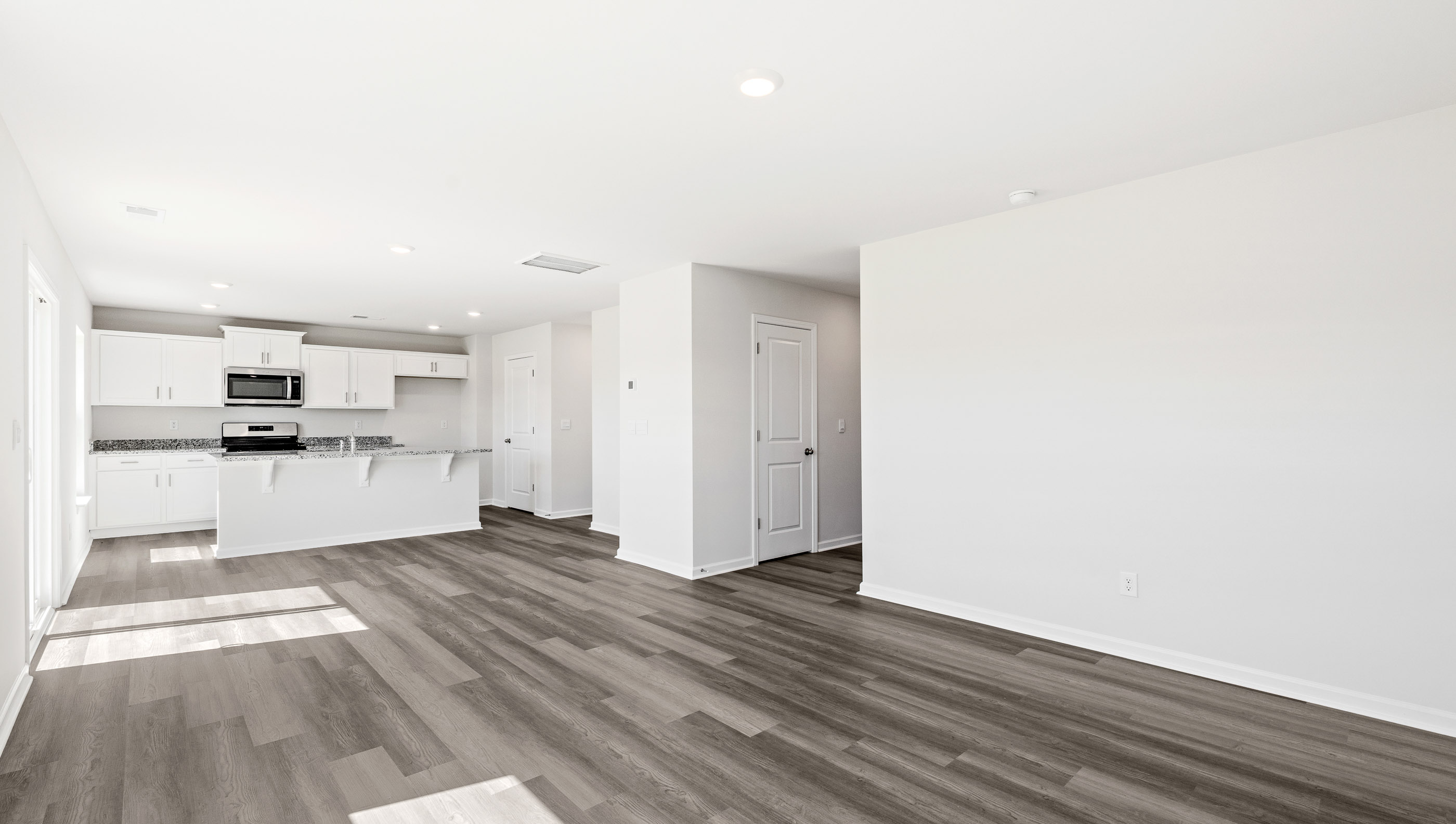 Open living area with view of kitchen
