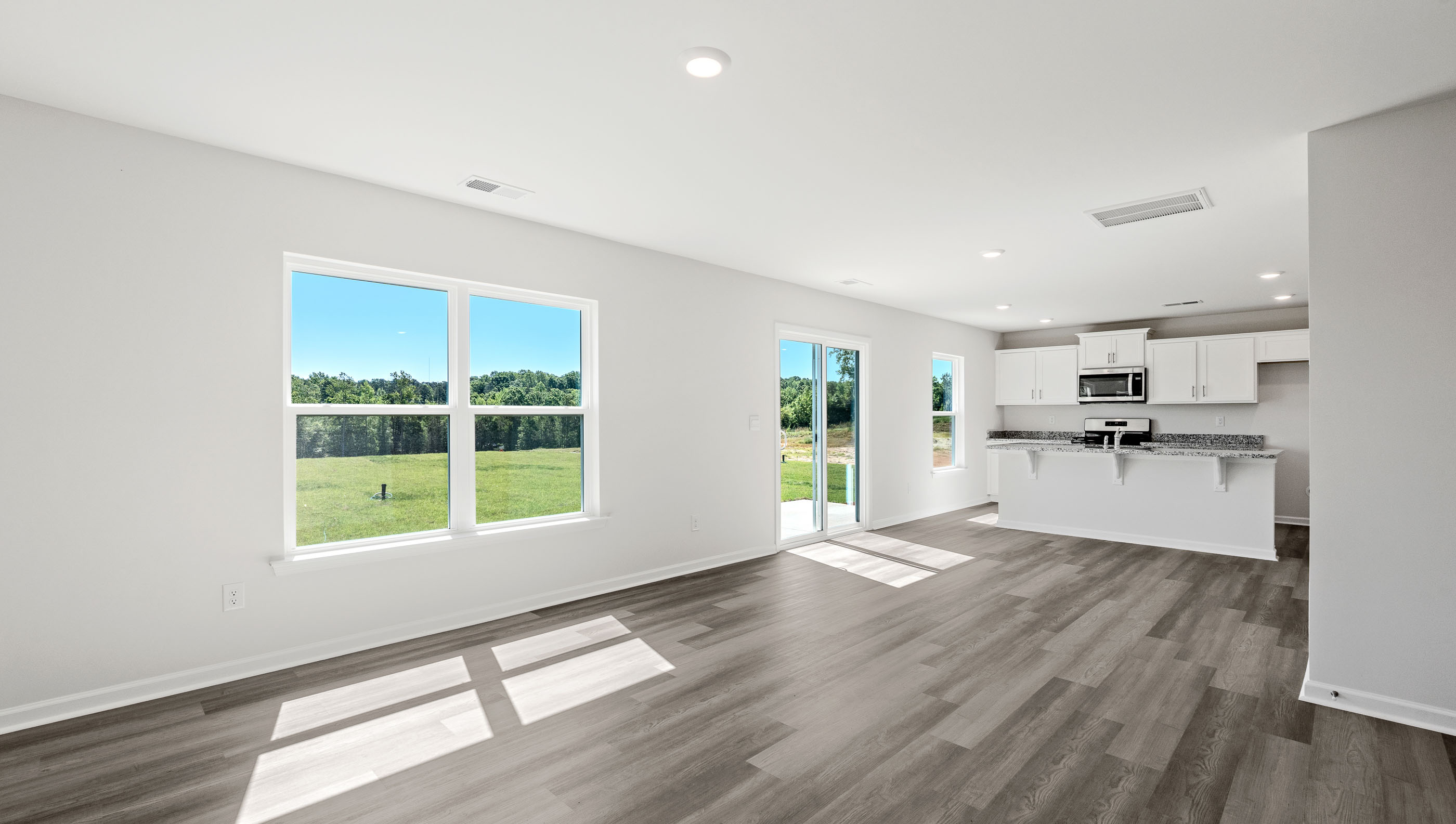 Open kitchen with large island and windows