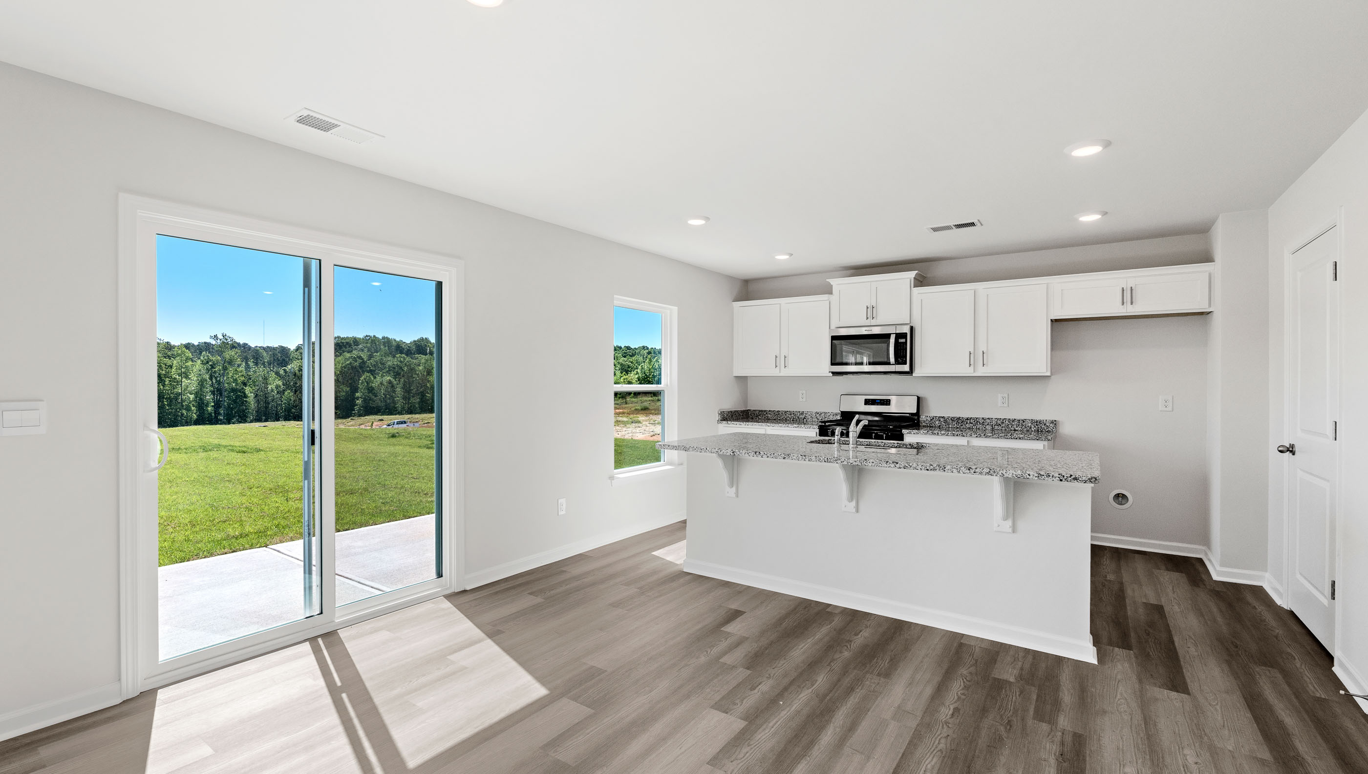 Open kitchen with large island and windows
