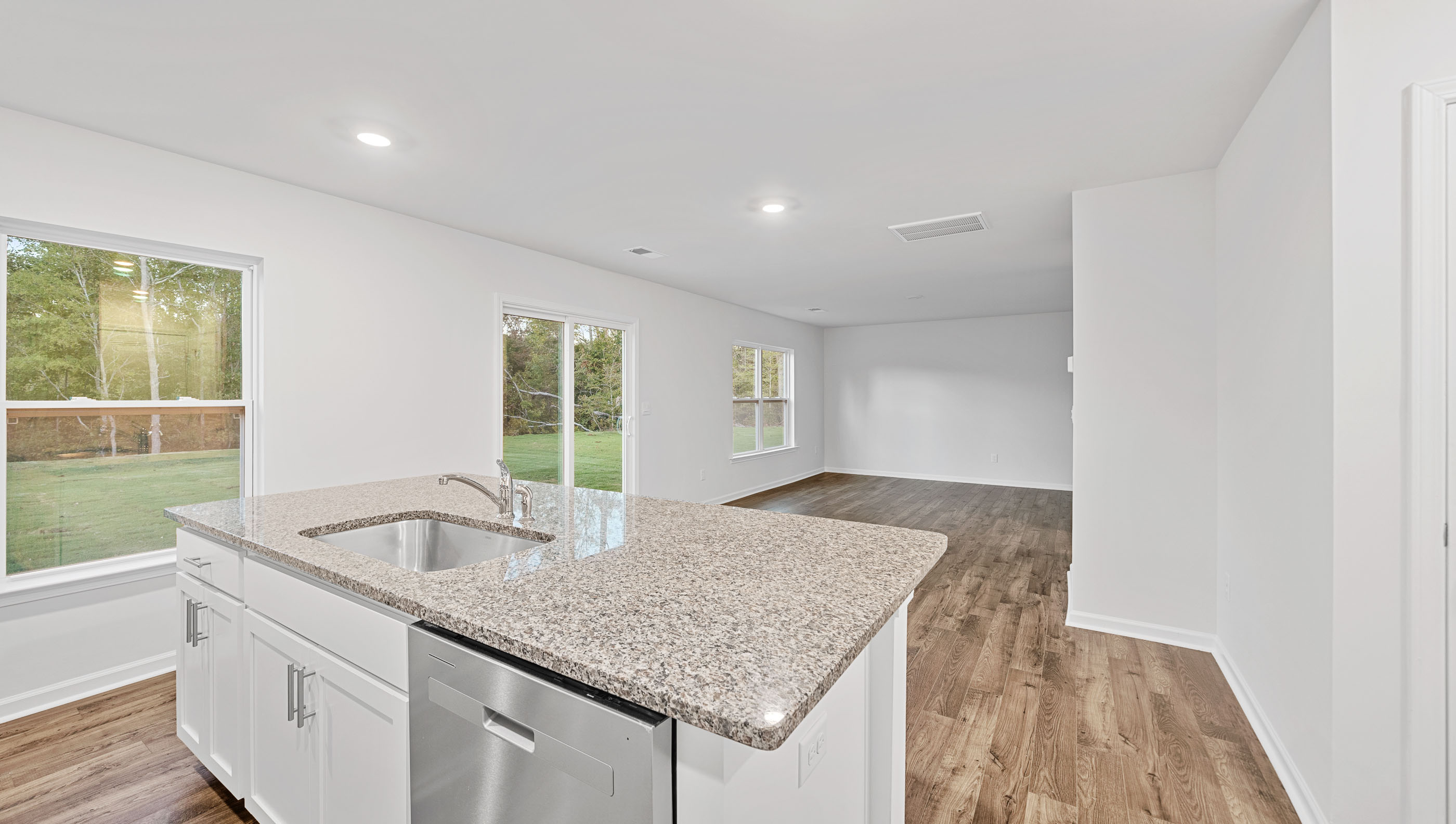 Open kitchen with large island and stainless steel appliances