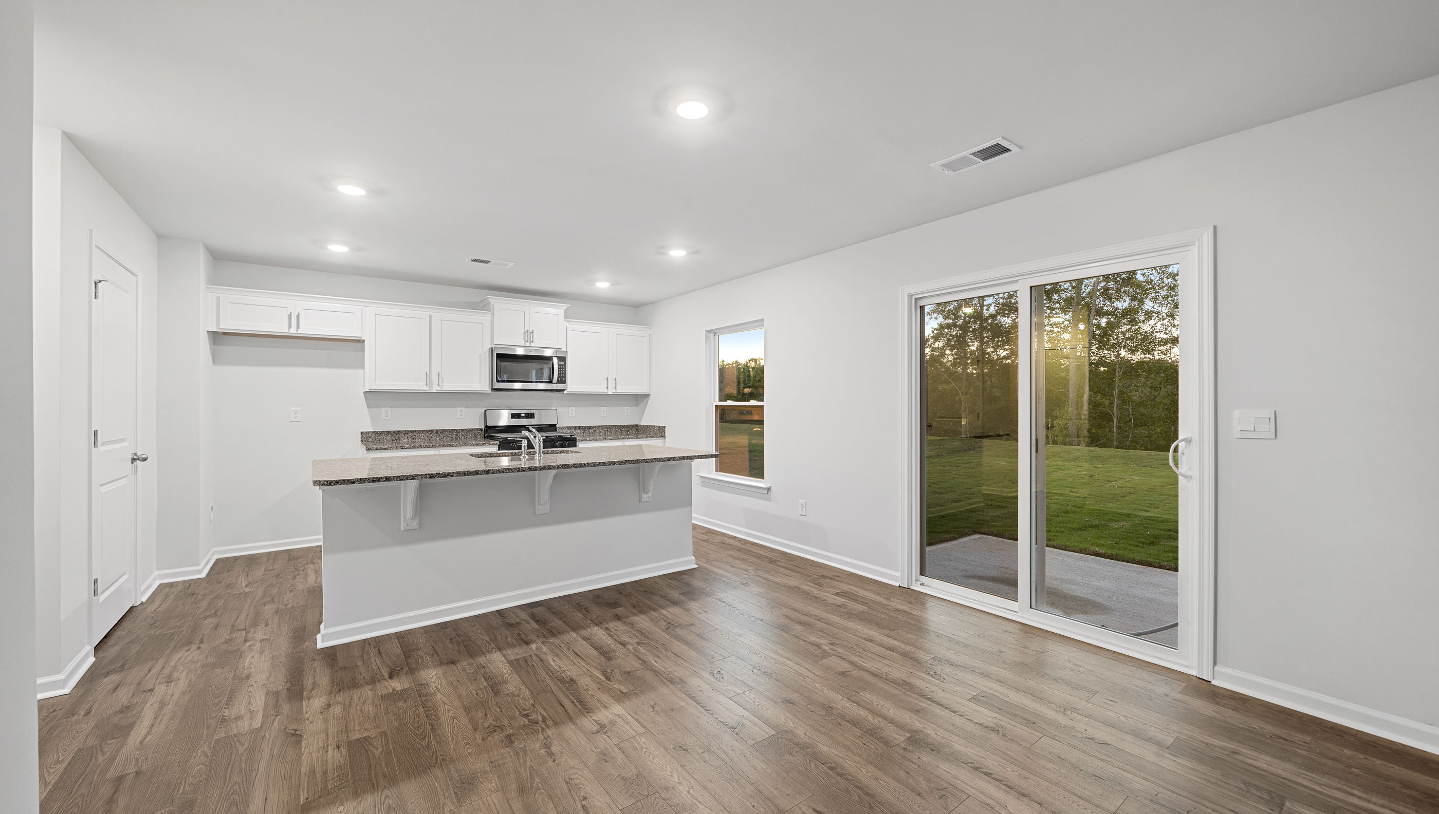 Open kitchen with large island and stainless steel appliances