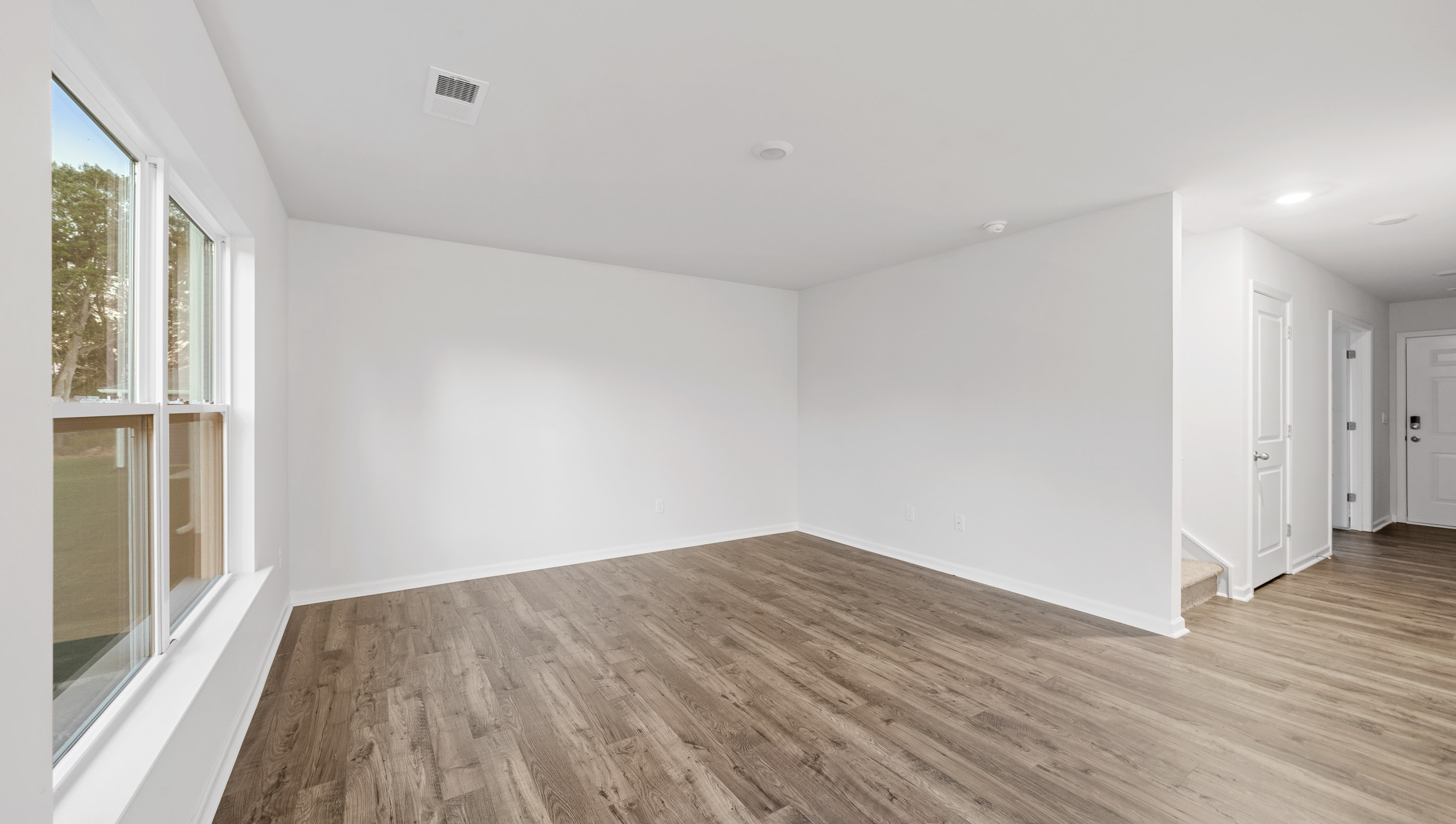 Open living room with large windows