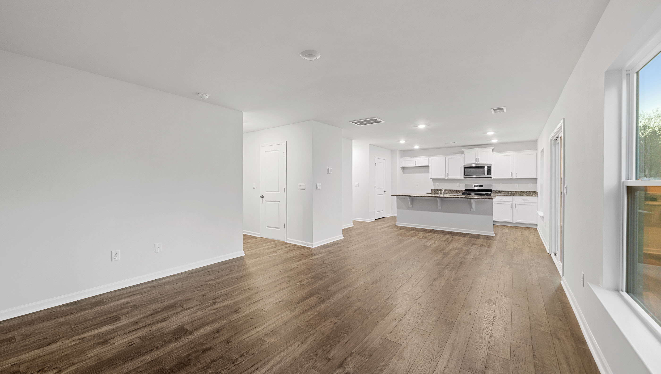 Open living room with large windows