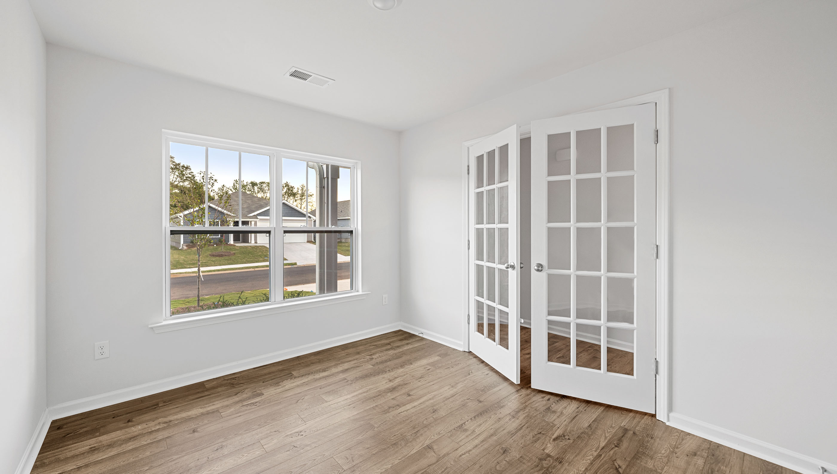 Study with large windows and glass doors
