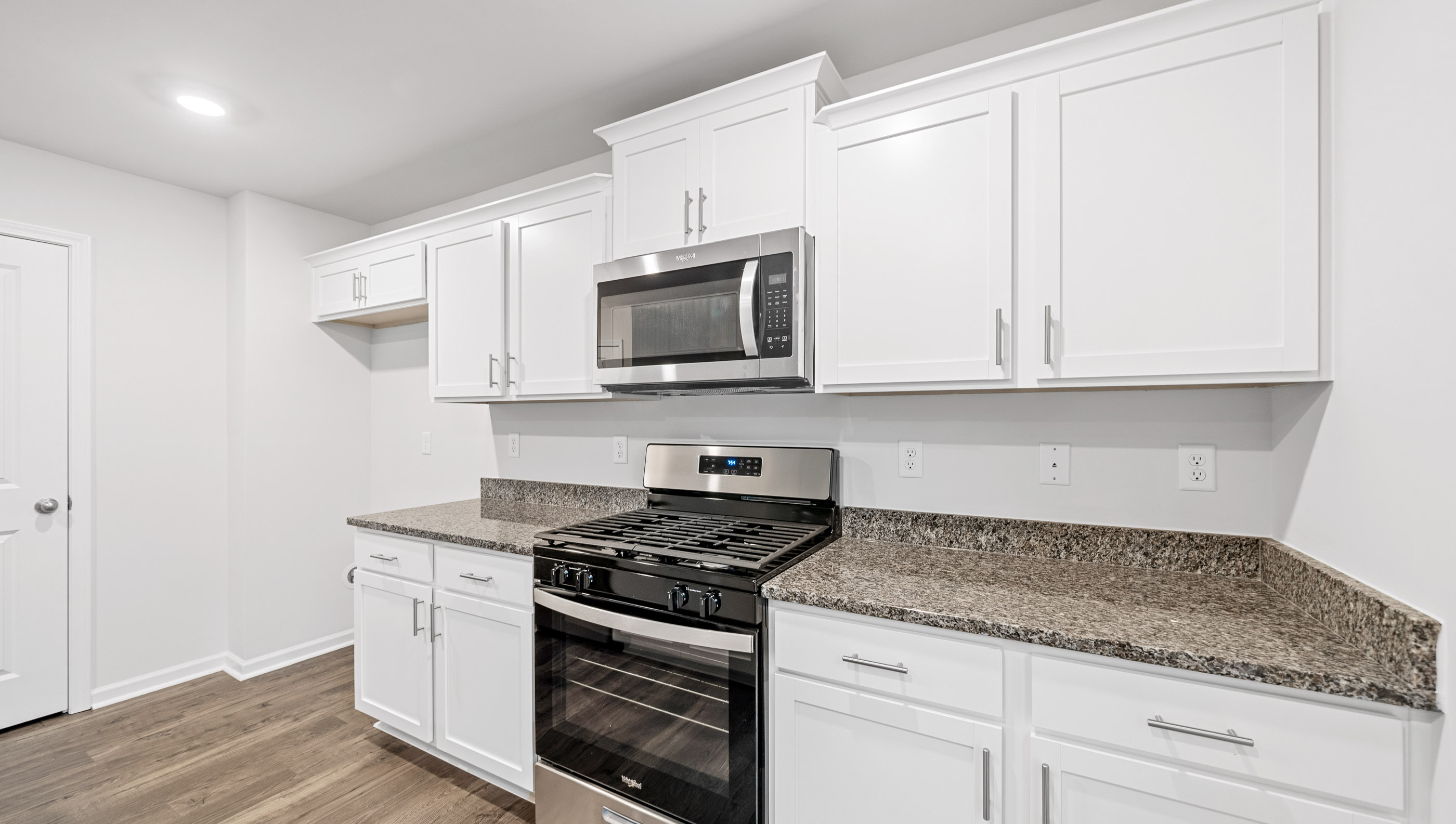 Open kitchen with large island and stainless steel appliances