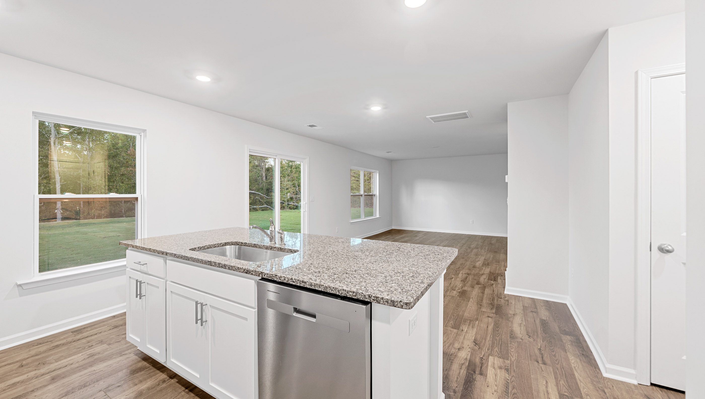 Open kitchen with large island and stainless steel appliances