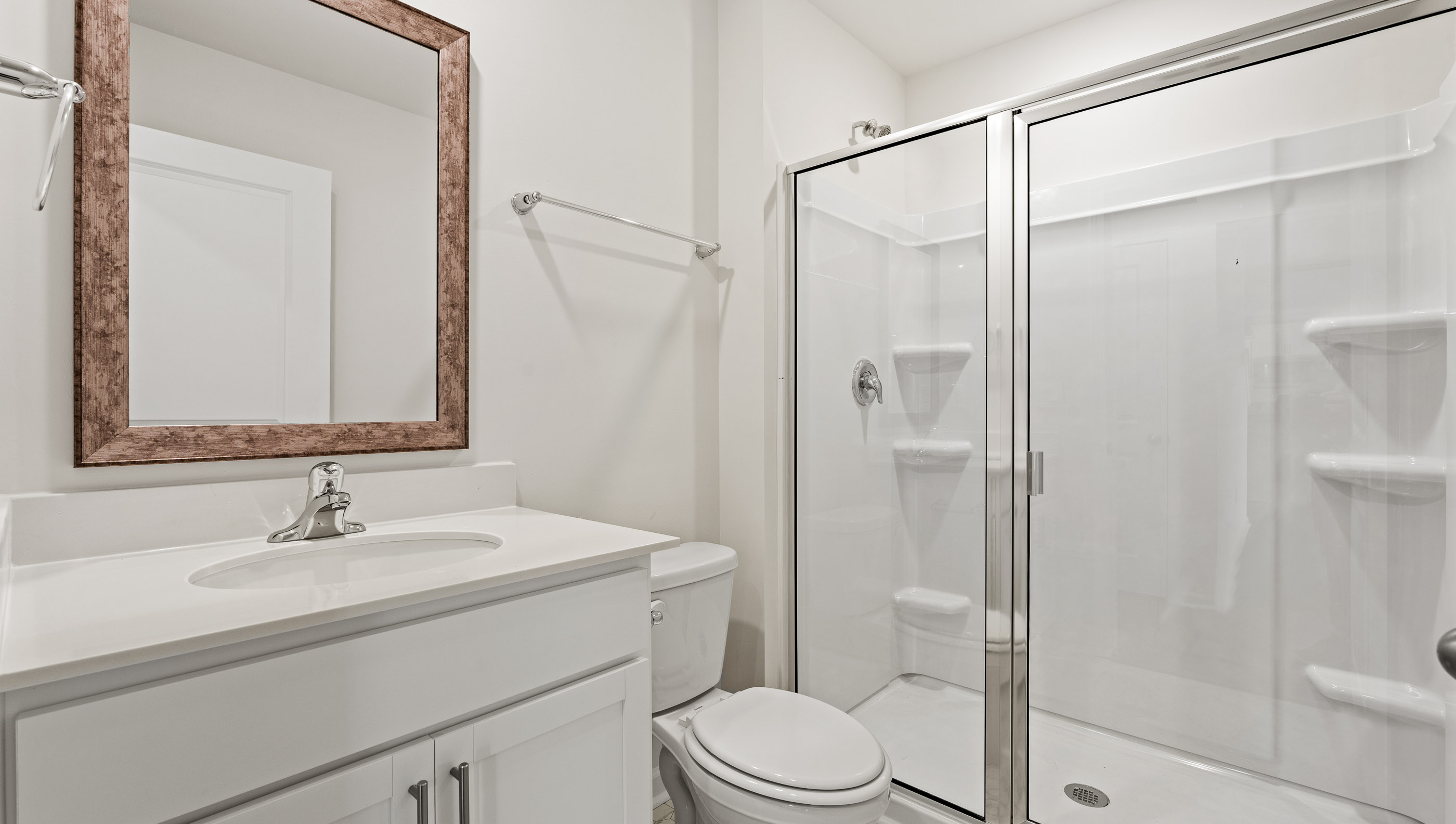 Bathroom with single vanity and shower