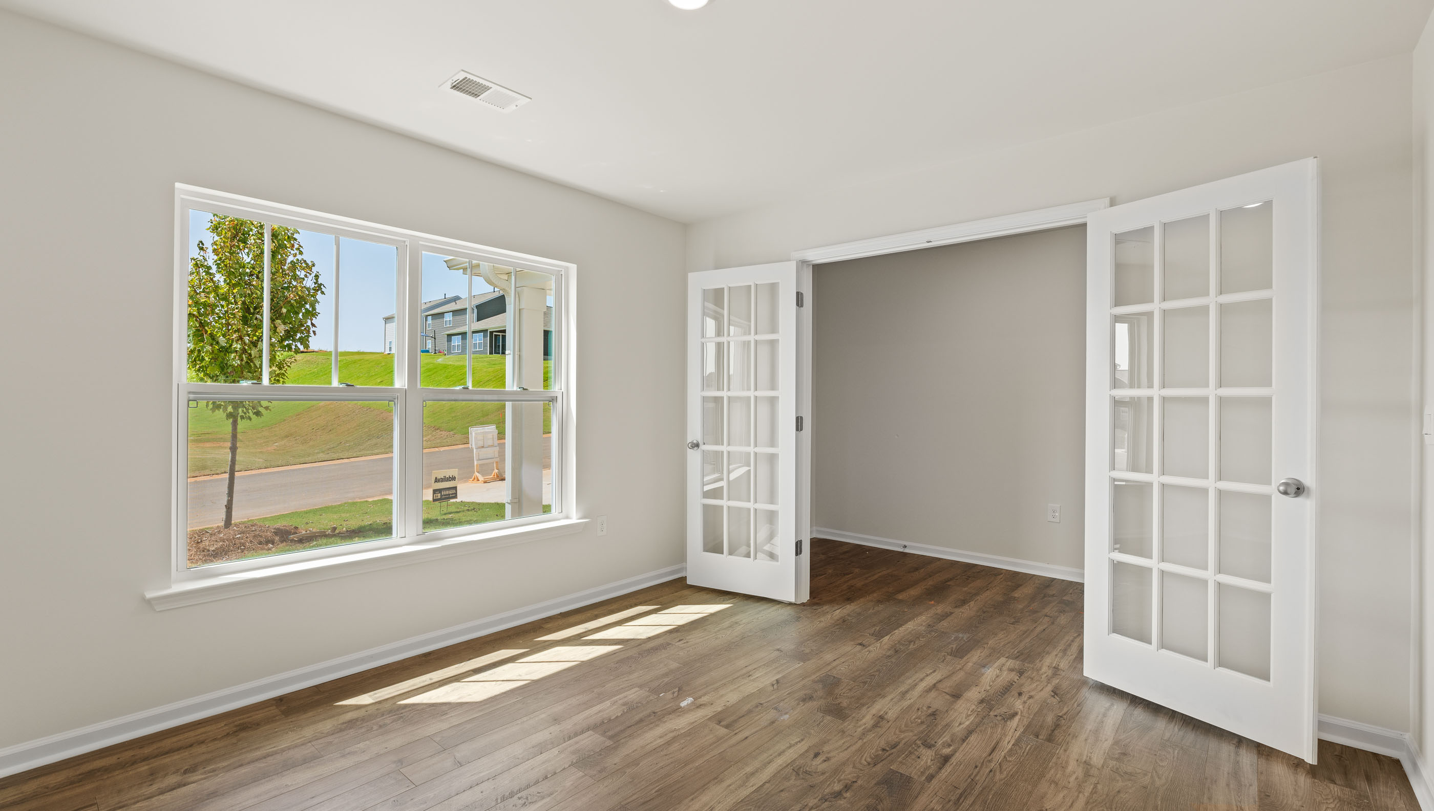 Office with glass doors and large windows