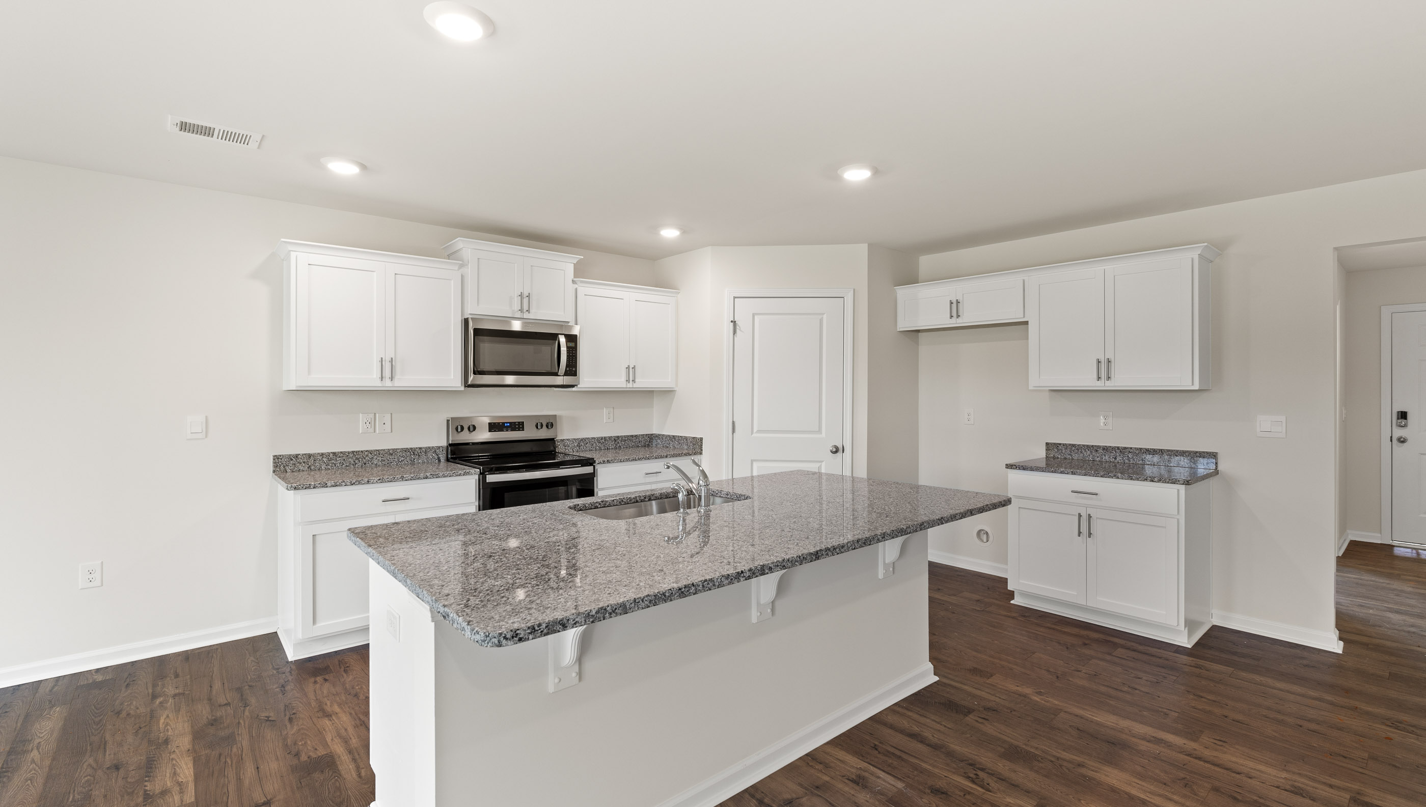 Kitchen with island and stainless steel appliances