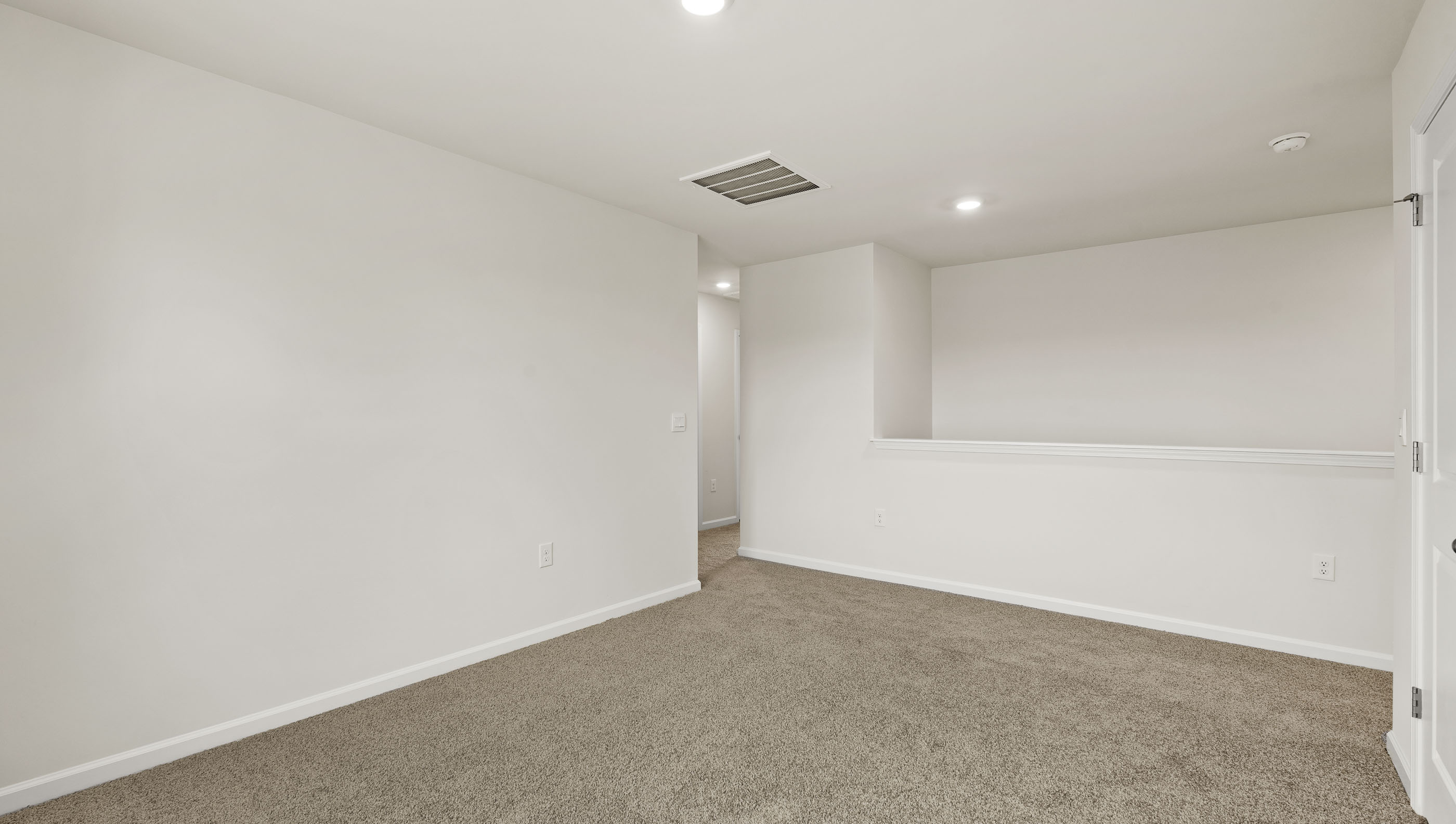 Carpeted bedroom with window