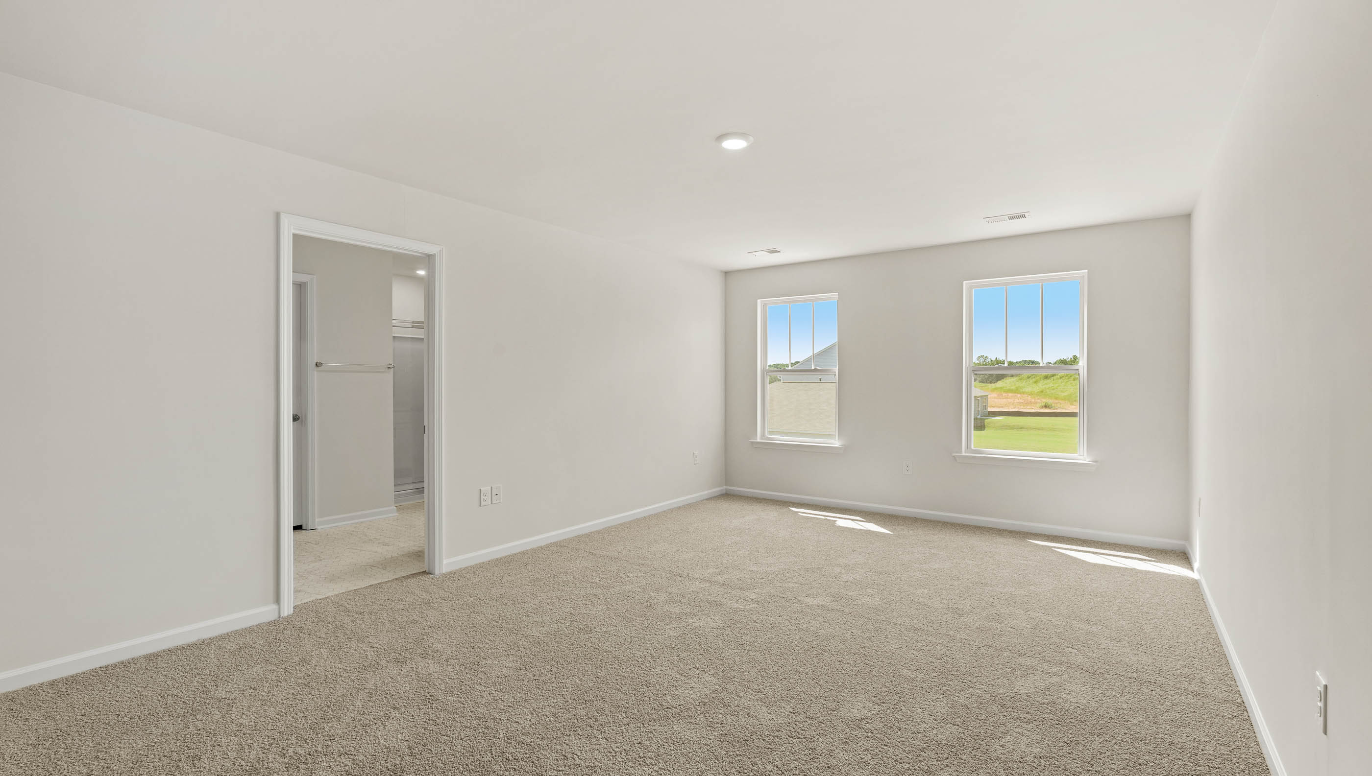 Carpeted bedroom with window