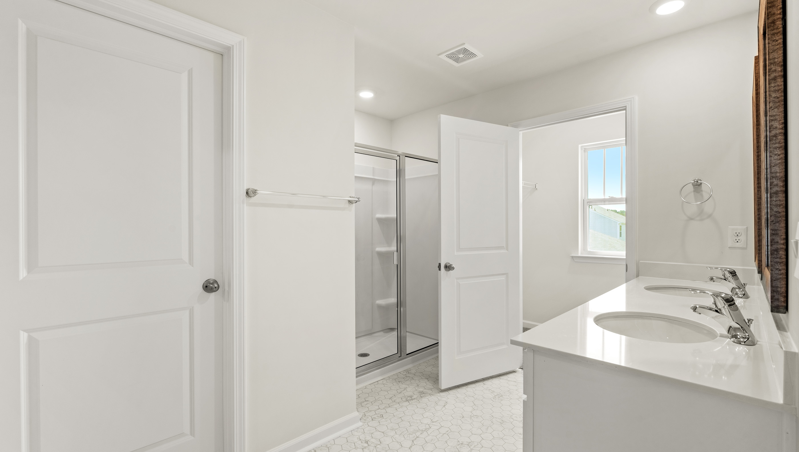 Bathroom with vanity and shower