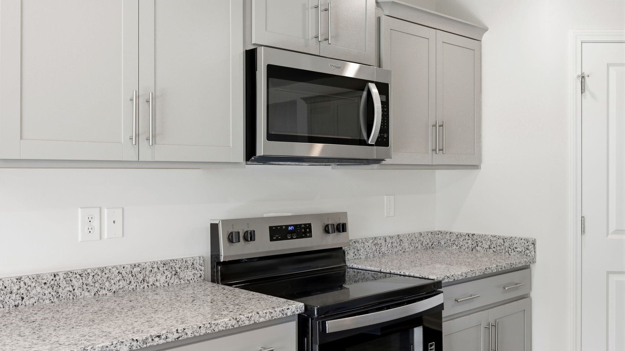 Open concept kitchen with large island and stainless steel appliances