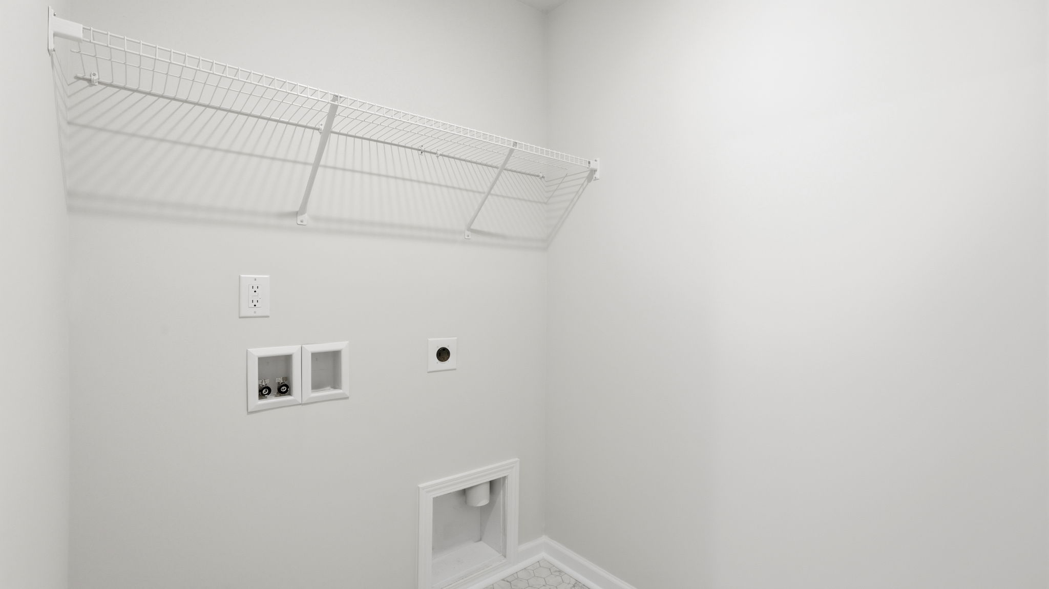 Laundry room with shelving
