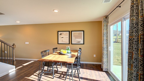 breakfast area beside kitchen with sliding glass door windows