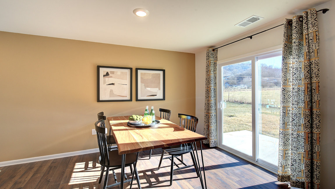 breakfast area beside kitchen, with sliding glass doors to outside