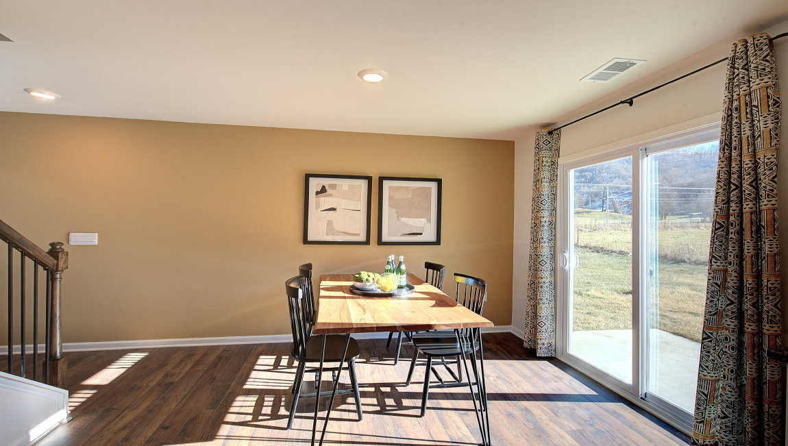 breakfast area beside kitchen, with sliding glass doors to outside