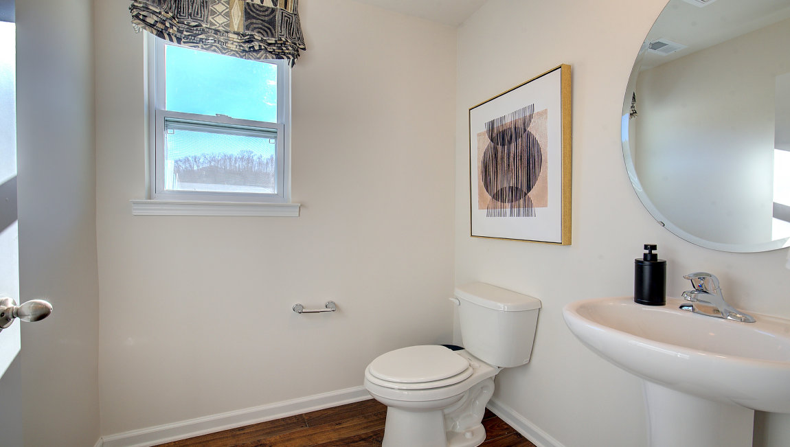 Bathroom with white counters and cabinets