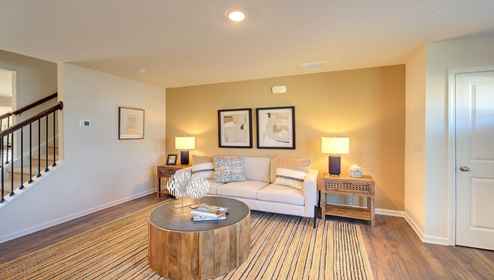 family room with view of front door and large window