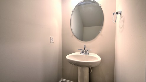 Powder bathroom with sink and toilet