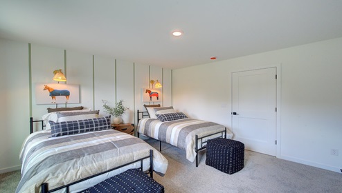 Carpeted bedroom with large window