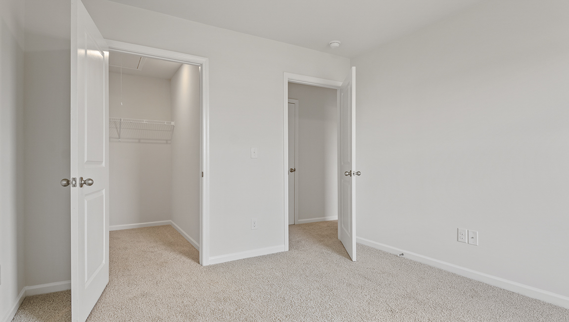 Seconardy bedroom with large window