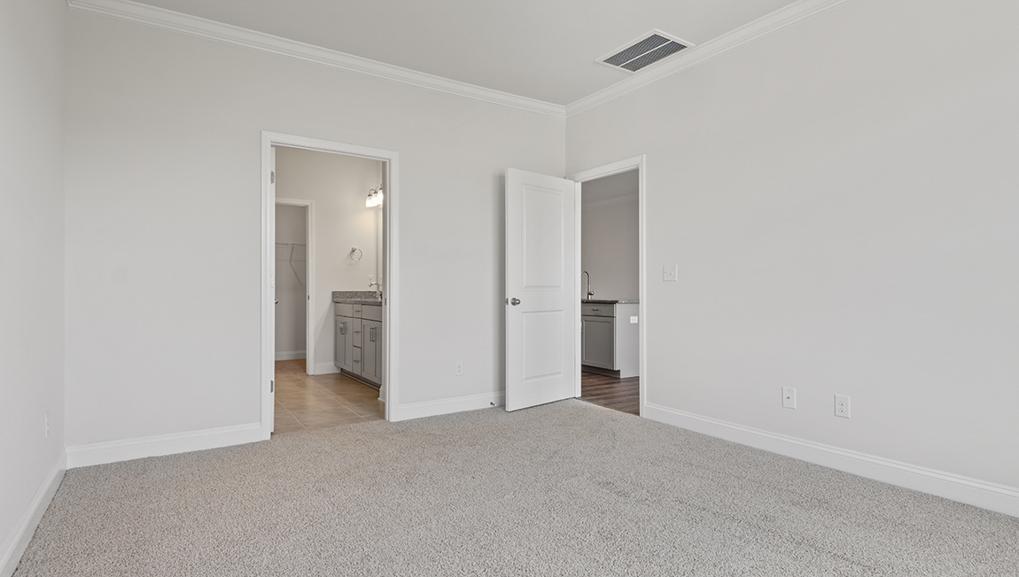 Primary bedroom with large window