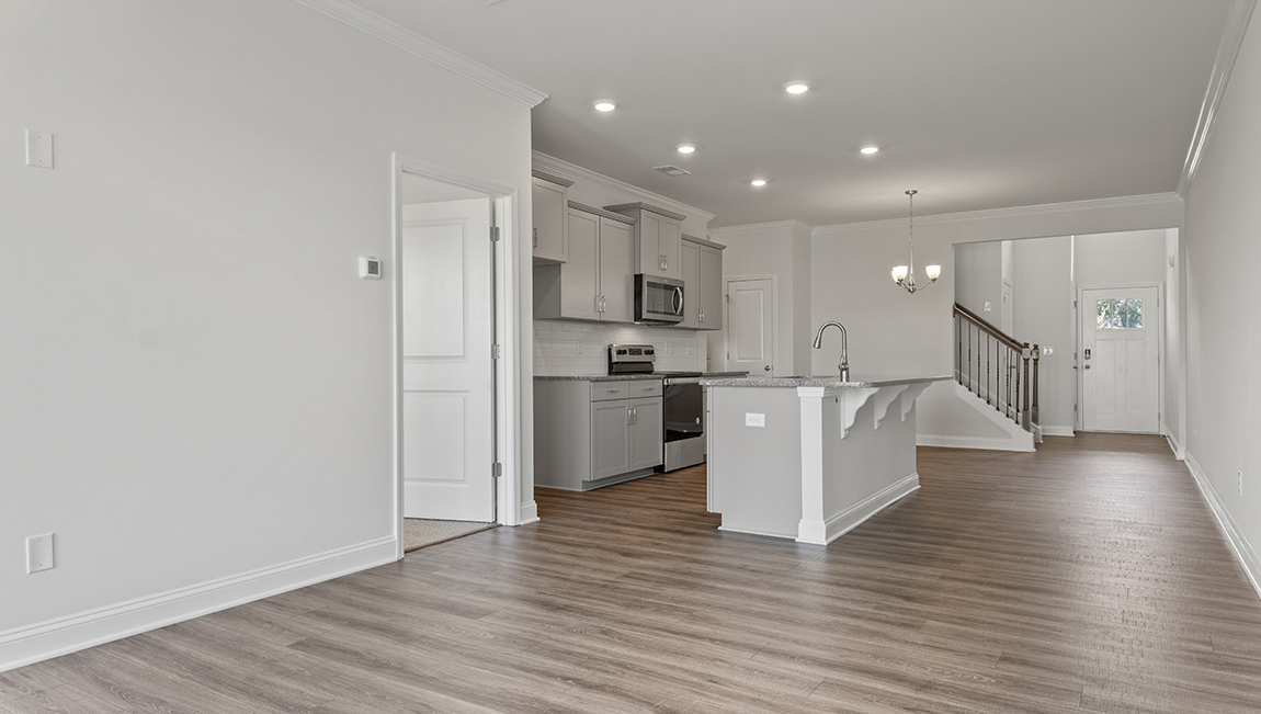 Kitchen and island with stainless steel appliances