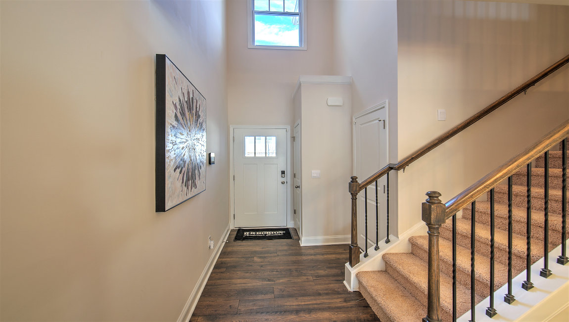 Welcoming foyer with stairs