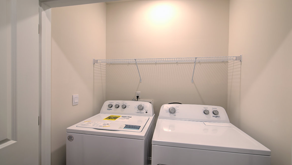 Laundry room with wash and dryer