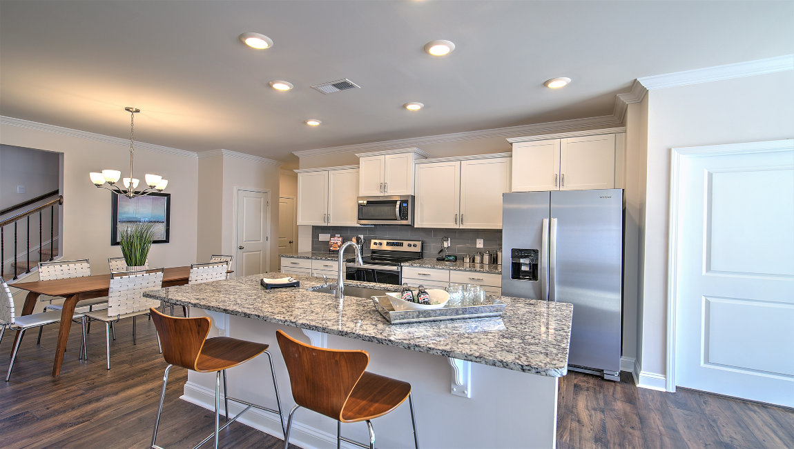 Open kitchen with island and stainless steel appliances