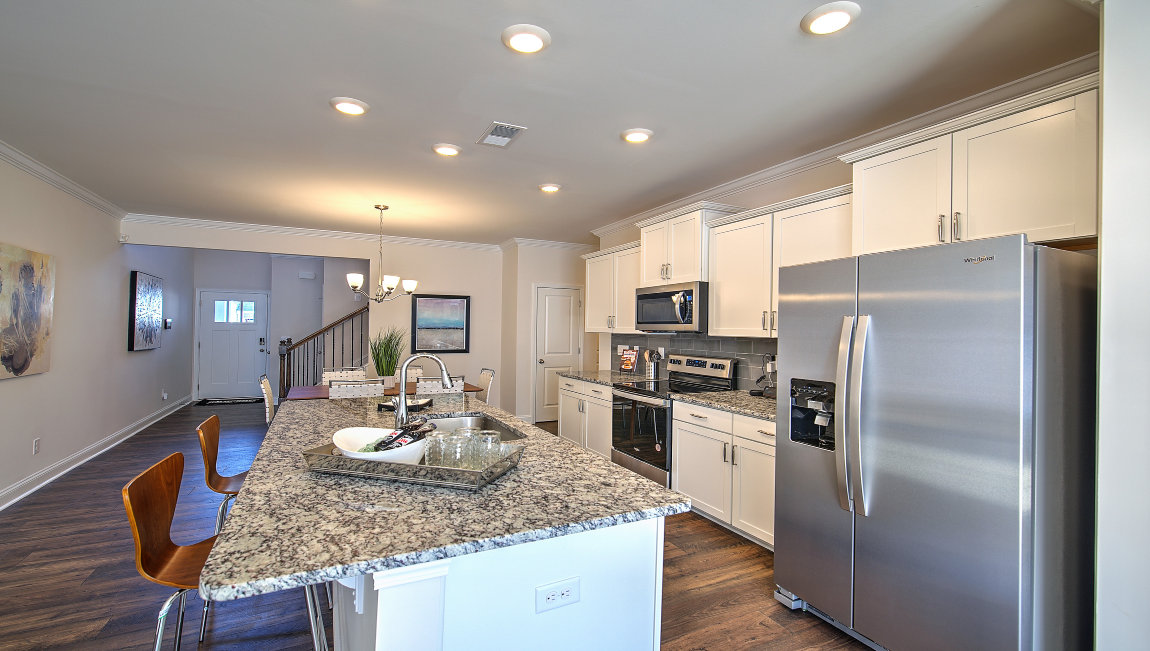 Open kitchen with island and stainless steel appliances
