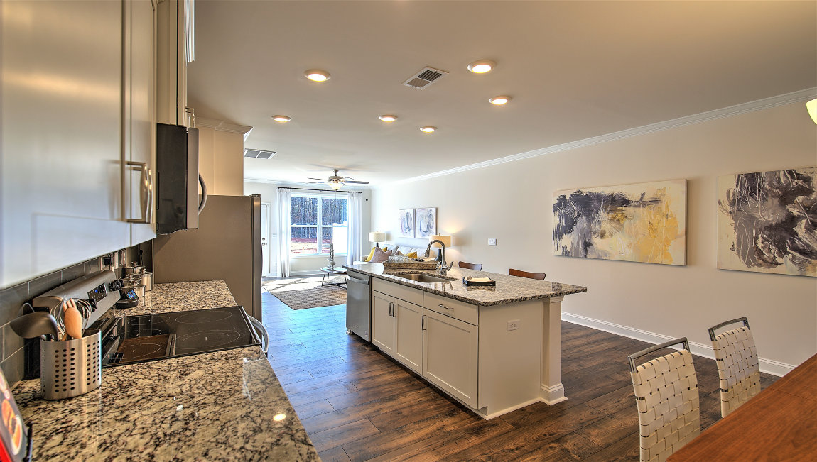 Open kitchen with island and stainless steel appliances