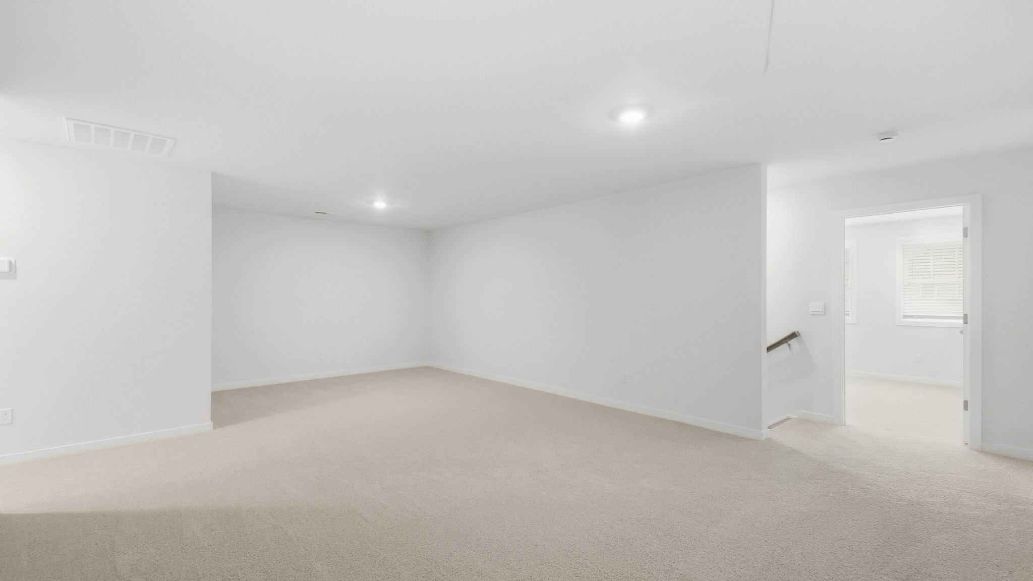 Carpeted large loft area