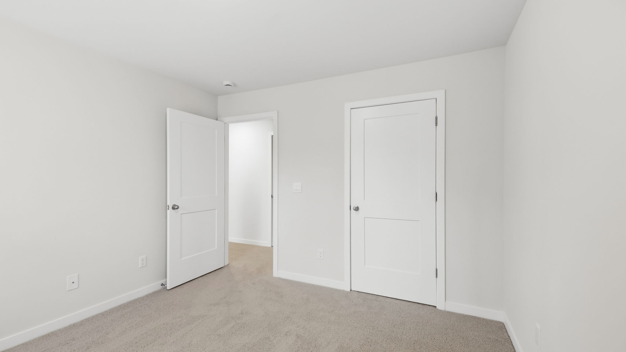 Carpeted bedroom with closet