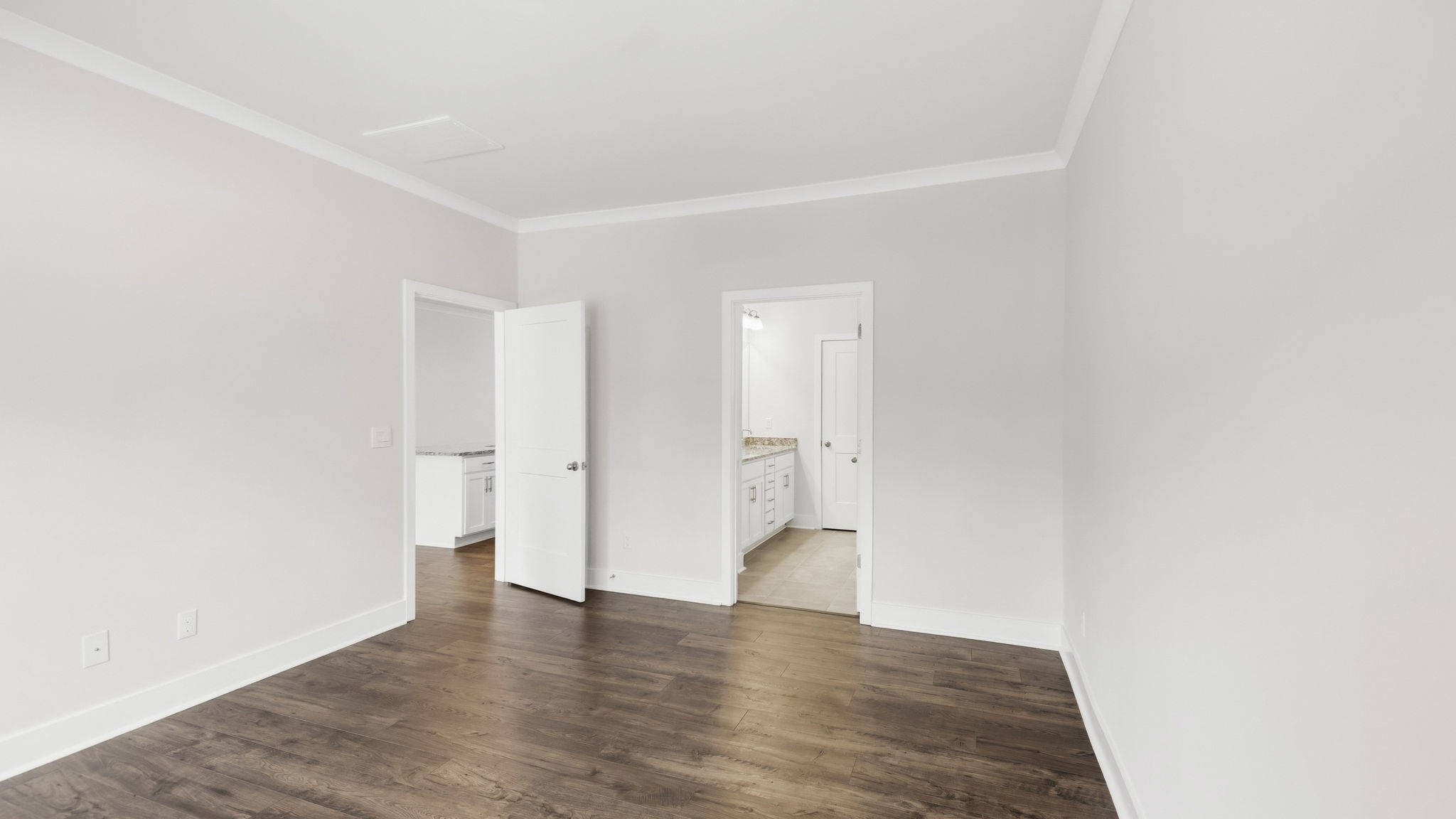 Primary bedroom with attached bathroom