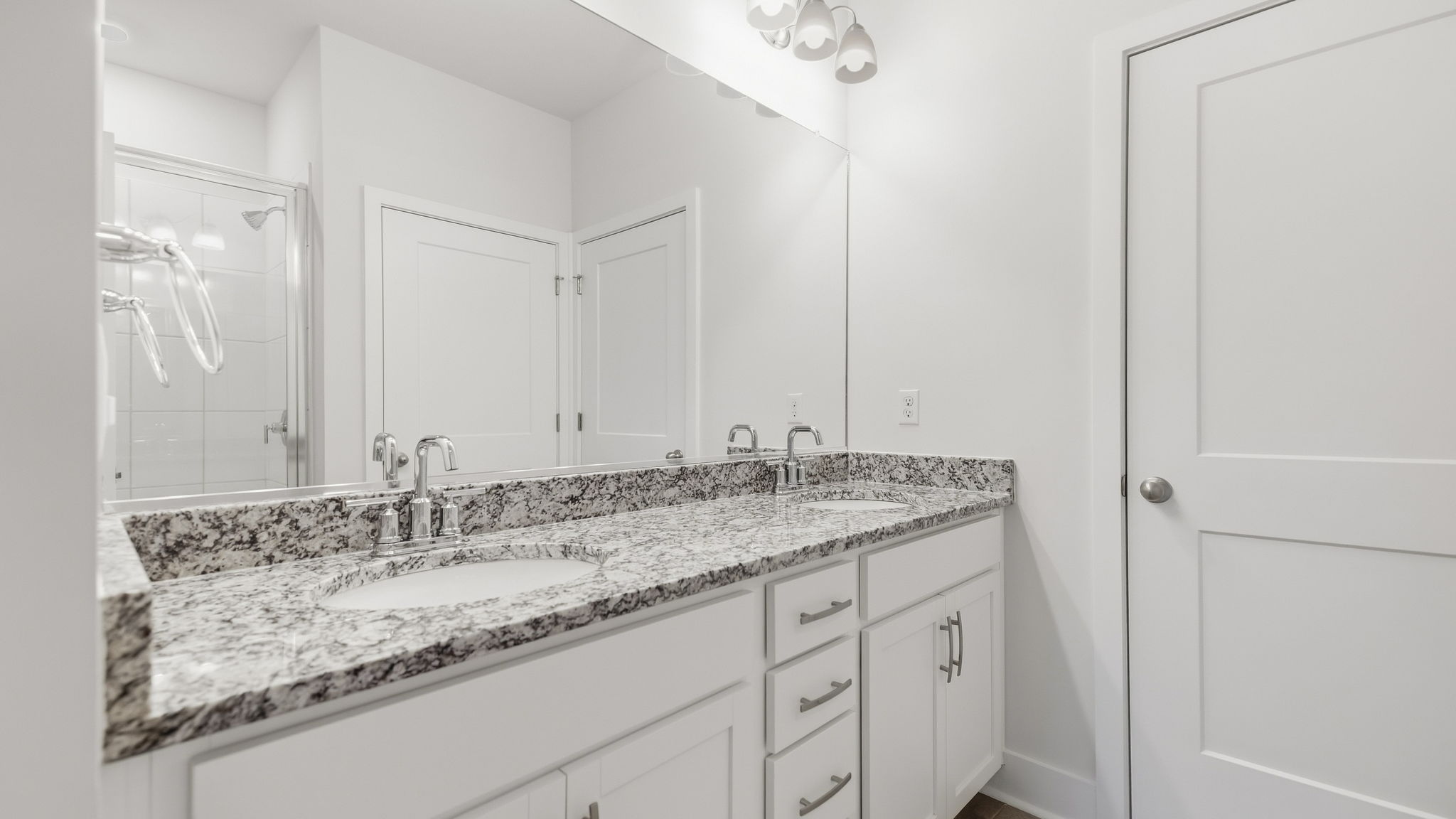 Primary bathroom with deal vanity