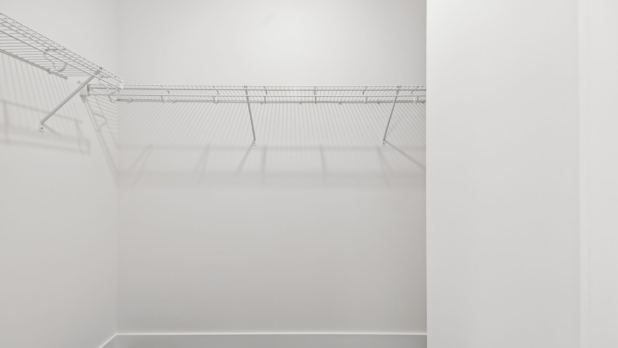 Walk in closet with shelving