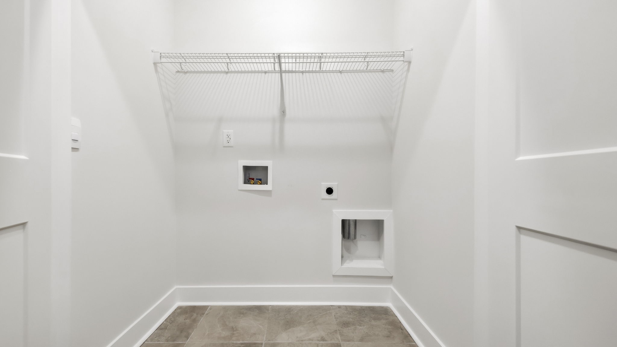 Laundry room with shelving