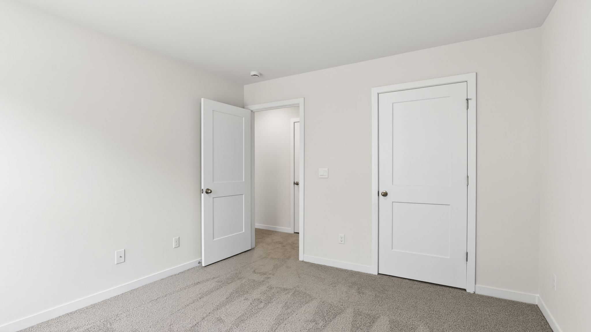 Carpeted bedroom with closet