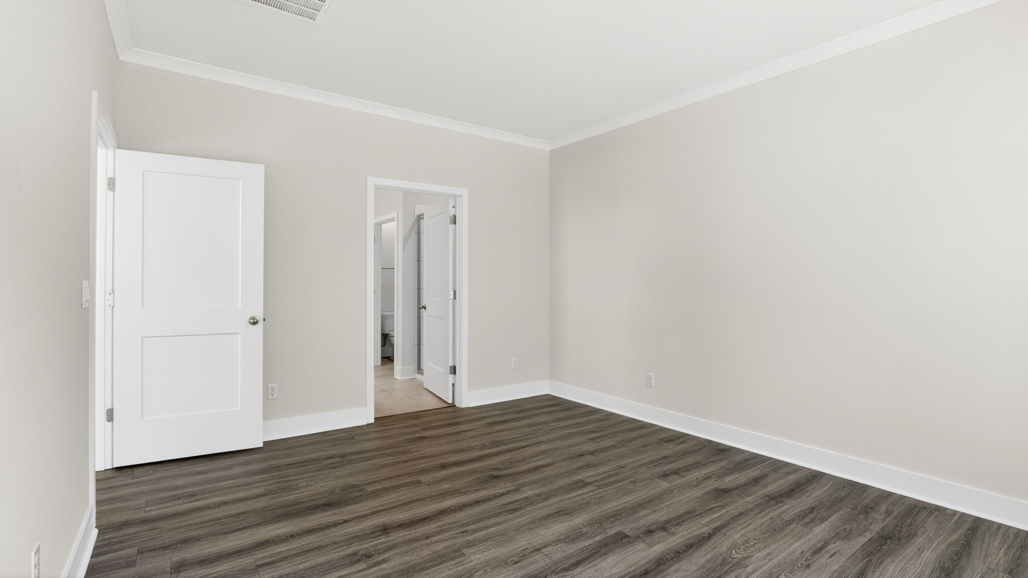 Primary bedroom with attached bathroom