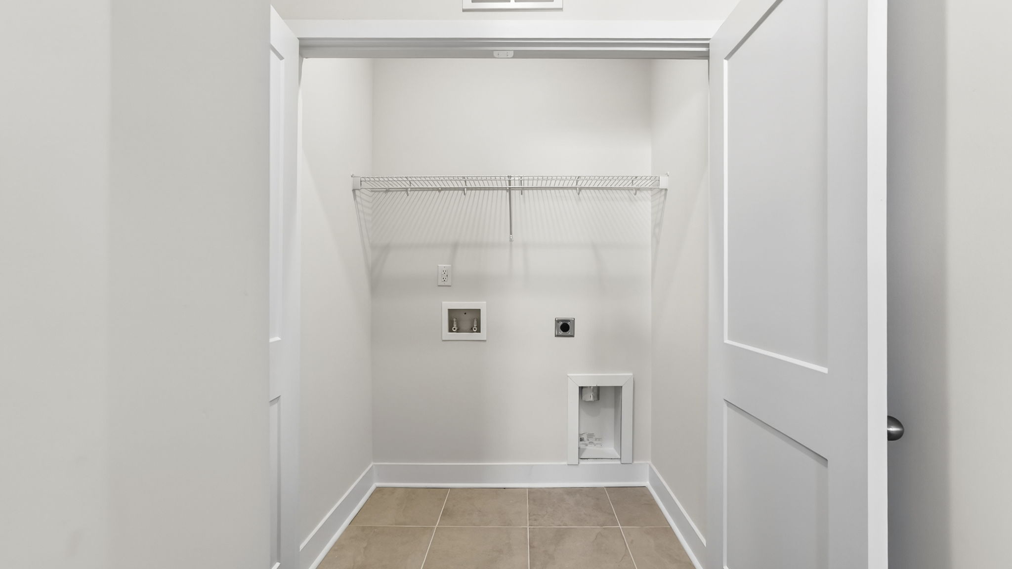 Laundry room with shelving