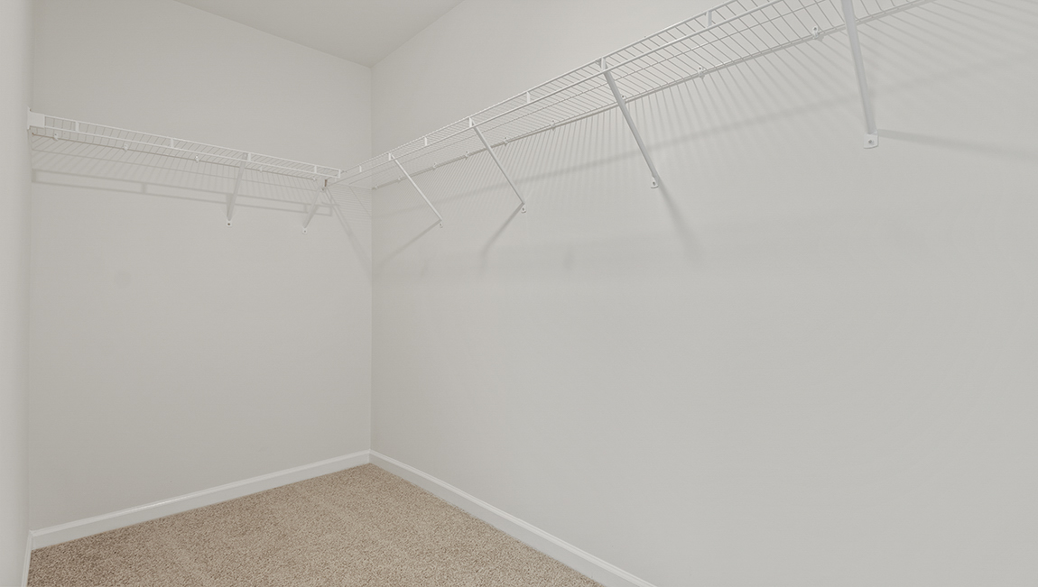 Carpeted bedroom with large window