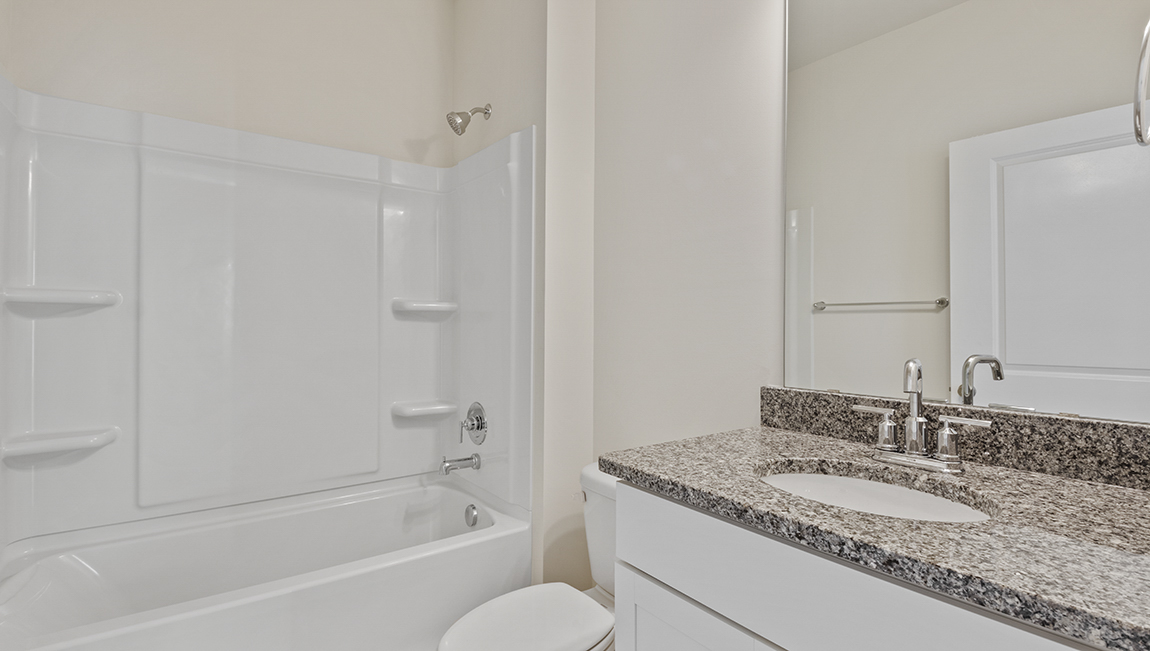 Bathroom with bathtub and shower combination